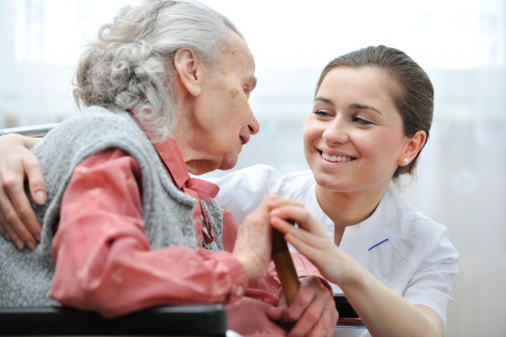 elderly woman with her nurse