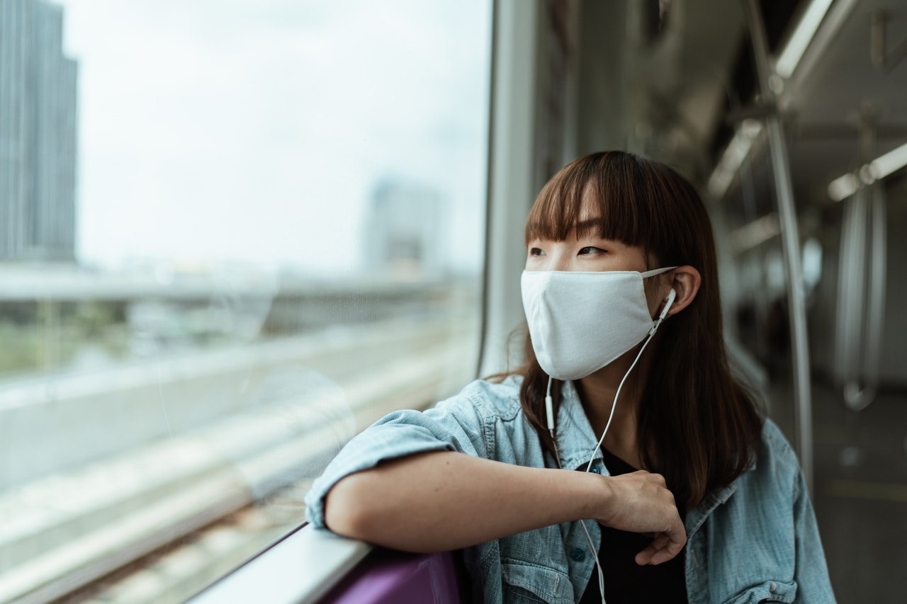 woman wearing mask public transportation