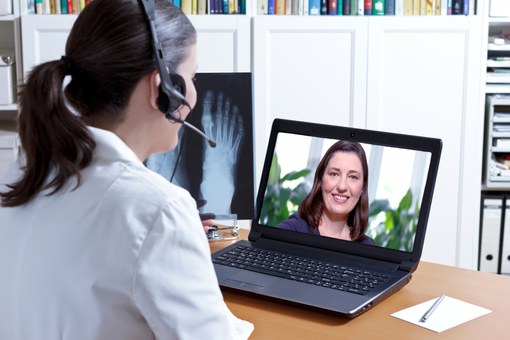 A woman talking to her doctor on a video call