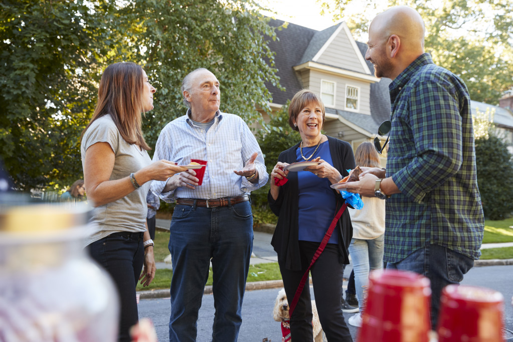 A retiree having fun at home with colleagues