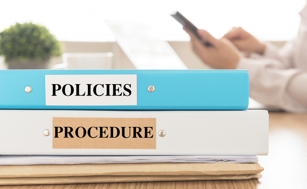 policies and procedures documents on a desk