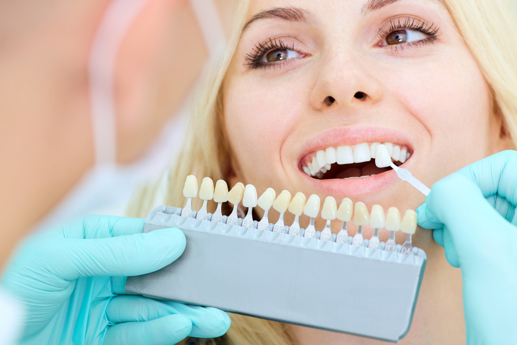 A woman picking the right dental implant