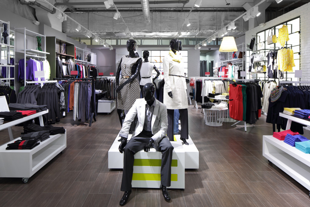 A clothing store with mannequins displayed in the middle