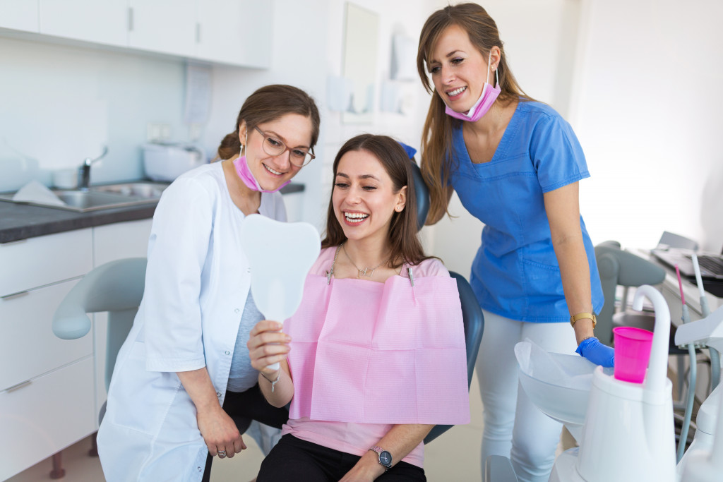 Dentists with her patient
